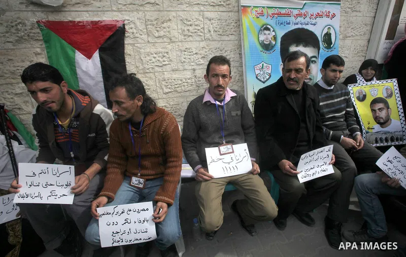 Palestinians take part in a protest against the death of a Palestinian detainee in an Israeli jail, in Gaza City February 25, 2013. Palestinian officials on Saturday demanded an international investigation into the death...