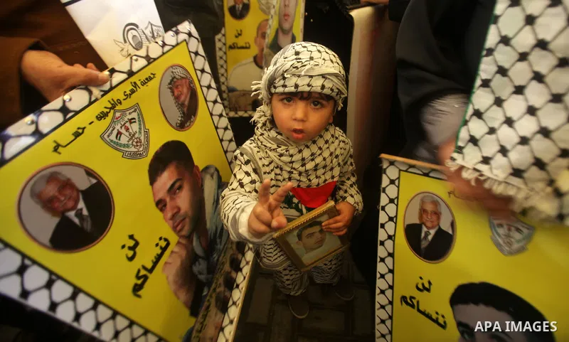 Palestinians take part in a protest against the death of a Palestinian detainee in an Israeli jail, in Gaza City February 25, 2013. Palestinian officials on Saturday demanded an international investigation into the death...
