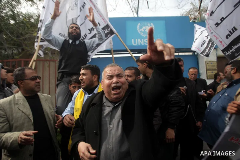 Palestinians take part in a protest against the death of a Palestinian detainee in an Israeli jail, in front of the headquarters of the United Nations in Gaza City February 25, 2013. Palestinian officials on Saturday dem...