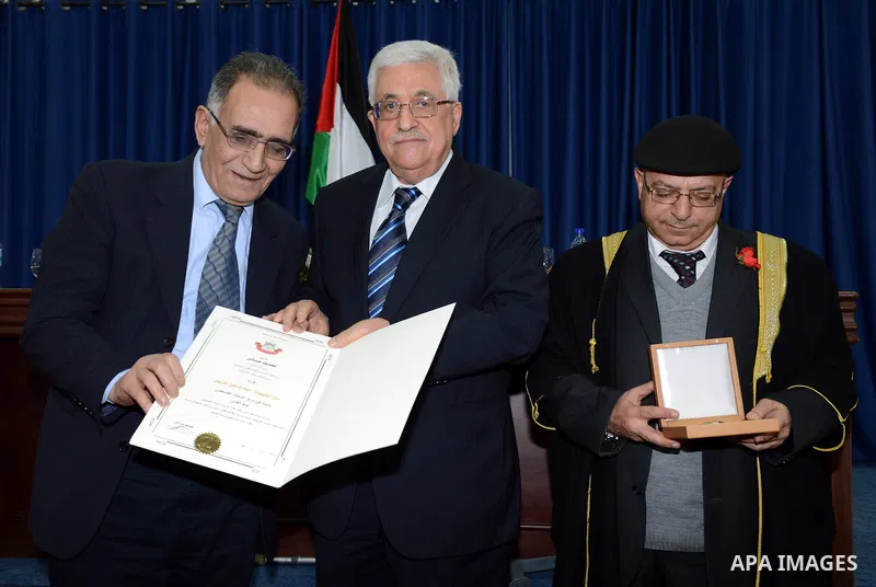 Palestinian President Mahmoud Abbas honors the Martyrs of the Research Center by the Order of Jerusalem in the West Bank city of Ramallah on February 25, 2013. Photo by Thaer Ganaim