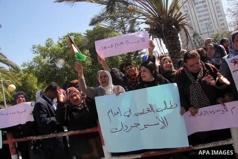 Palestinian women gather for a demonstration calling for the end of the political division between the Gaza Strip Hamas-led leadership and the Palestinian Authority Fatah-led in Gaza city, on Feb. 26, 2013. Photo by Ezz...