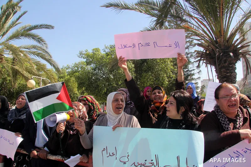 Palestinian women gather for a demonstration calling for the end of the political division between the Gaza Strip Hamas-led leadership and the Palestinian Authority Fatah-led in Gaza city, on Feb. 26, 2013. Photo by Ezz...