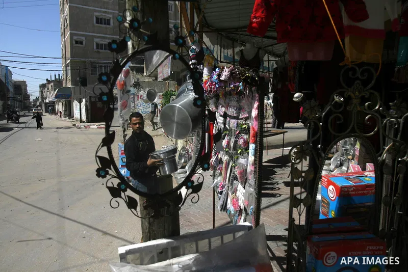 A Palestinian vendor displays his goods at street in Rafah city in the southern Gaza Strip, on Feb. 26, 2013. Photo by Eyad Al Baba