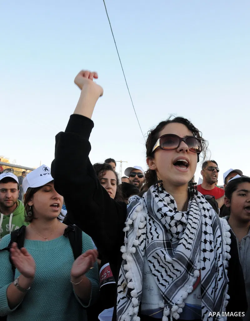 Palestinians take part in a protest against the opening project of the street number (4) in the middle of Bet Safafa neighbourhood, which is for settlement project services, in Jerusalem on February 26, 2013. Photo by Ma...