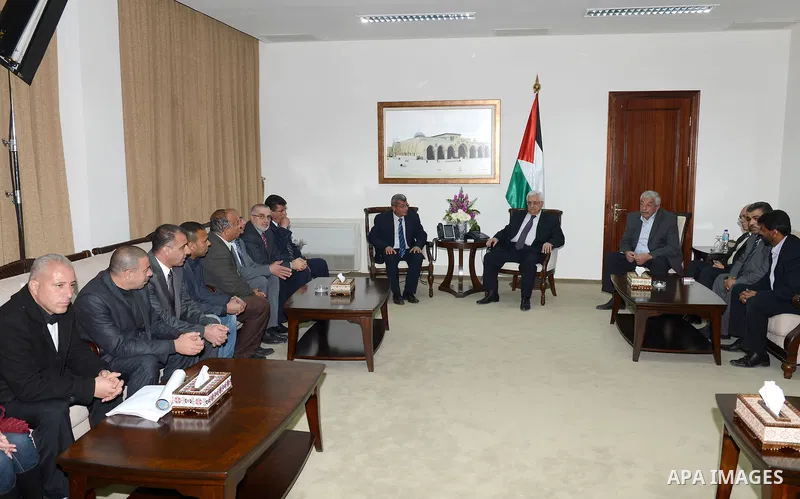Palestinian President Mahmoud Abbas meets with the members of Palestinian prisoner's club, in the West Bank city of Ramallah on February 26, 2013. Photo by Thaer Ganaim