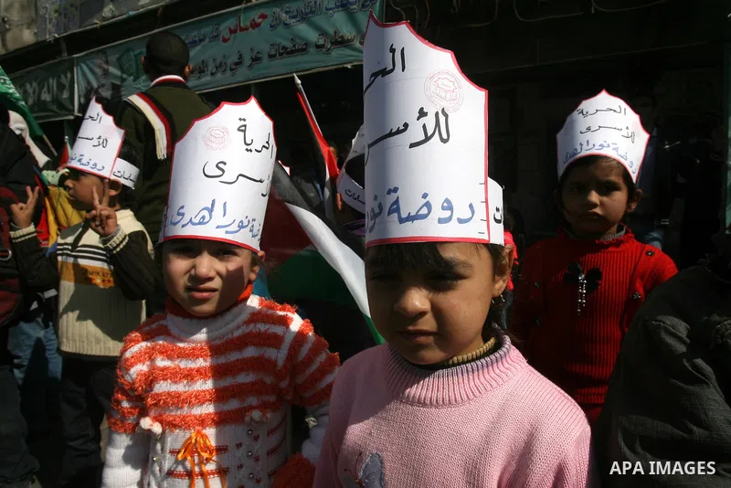 Palestinian children take part in a protest against the death of a Palestinian detainee in an Israeli jail, in Rafah city in the southern Gaza Strip on Feb. 27, 2013. Palestinian officials on Saturday demanded an interna...