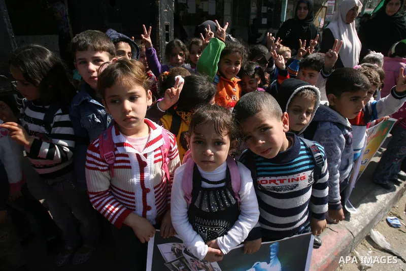 Palestinian children take part in a protest against the death of a Palestinian detainee in an Israeli jail, in Rafah city in the southern Gaza Strip on Feb. 27, 2013. Palestinian officials on Saturday demanded an interna...