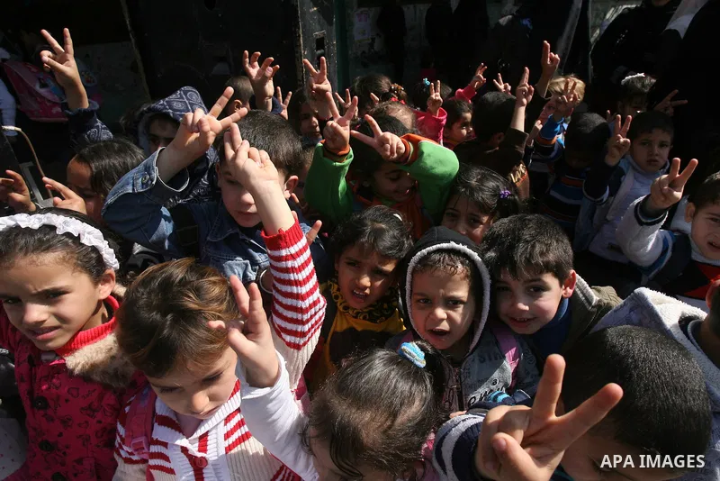 Palestinian children take part in a protest against the death of a Palestinian detainee in an Israeli jail, in Rafah city in the southern Gaza Strip on Feb. 27, 2013. Palestinian officials on Saturday demanded an interna...