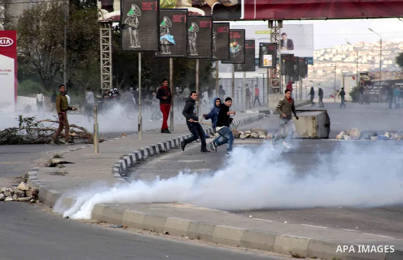 Palestinian protesters throw stones at Israeli security forces during clashes near Huwwara checkpoint, near the West Bank city of Nablus, 28 February 2013. Hunger strikes by Palestinians in Israeli prisons have sparked c...