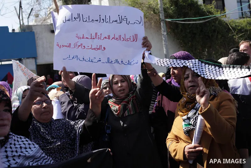 Palestinian women shout slogans as they march in Gaza City on March 05, 2013 during a rally for the International Women's Day which is celebrated worldwide on March 8. Photo by Ashraf Amra