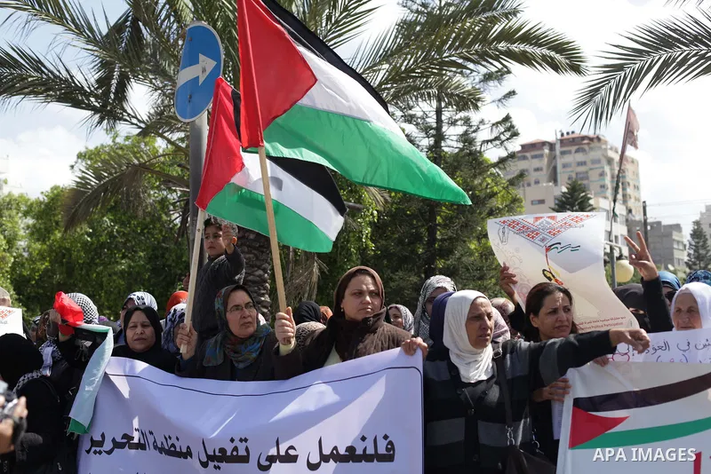 Palestinian women shout slogans as they march in Gaza City on March 05, 2013 during a rally for the International Women's Day which is celebrated worldwide on March 8. Photo by Ashraf Amra