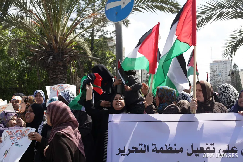 Palestinian women shout slogans as they march in Gaza City on March 05, 2013 during a rally for the International Women's Day which is celebrated worldwide on March 8. Photo by Ashraf Amra