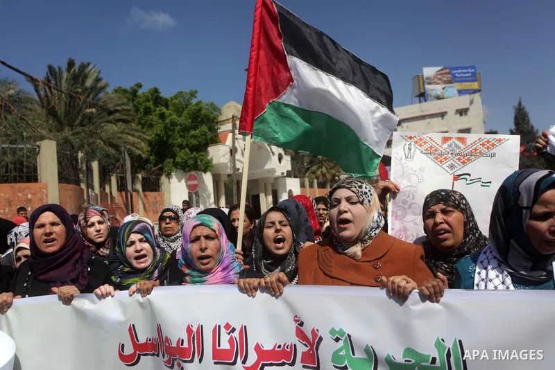 Palestinian women shout slogans as they march in Gaza City on March 05, 2013 during a rally for the International Women's Day which is celebrated worldwide on March 8. Photo by Ashraf Amra