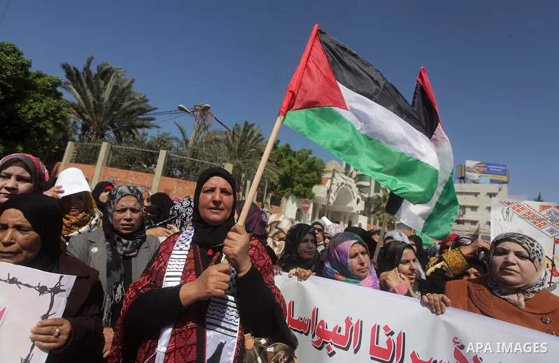 Palestinian women shout slogans as they march in Gaza City on March 05, 2013 during a rally for the International Women's Day which is celebrated worldwide on March 8. Photo by Ashraf Amra