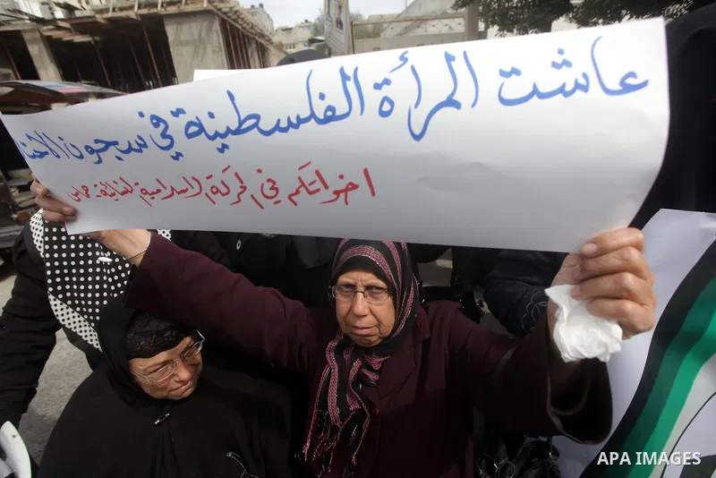 Palestinian women attend a protest calling for the release of Palestinian prisoners from Israeli jails in Gaza City on March 07, 2013 during a rally for the International Women's Day which is celebrated worldwide on Marc...