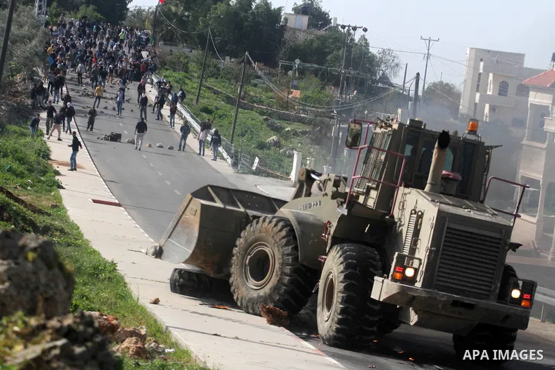 Palestinian protesters clash with Israeli soldiers following the funeral of Mohammed Asfour, 22, in the West Bank village of Aboud near Ramallah March 8, 2013. Asfour, shot by Israeli soldiers during a confrontation with...