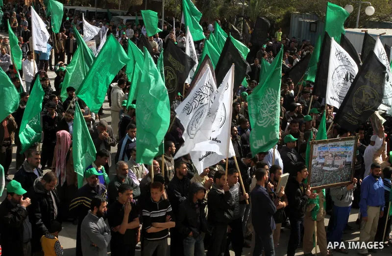 Hamas supporters chant slogans during a march following Friday prayers in Gaza City on March 8, 2013. Hamas and Islamic Jihad called a march in solidarity with the Al-Aqsa Mosque in Jerusalem's old city, Islam's third ho...