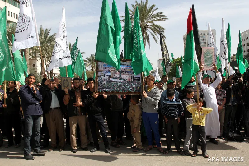 Hamas supporters chant slogans during a march following Friday prayers in Gaza City on March 8, 2013. Hamas and Islamic Jihad called a march in solidarity with the Al-Aqsa Mosque in Jerusalem's old city, Islam's third ho...