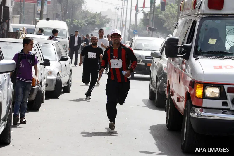 Palestinian youth take part in the symbolic marathon of Jerusalem titled "Freedom for Prisoners" in Gaza City on March 14, 2013 in response to the Jerusalem Marathon which was attended by 20000 racers from 52 countries i...