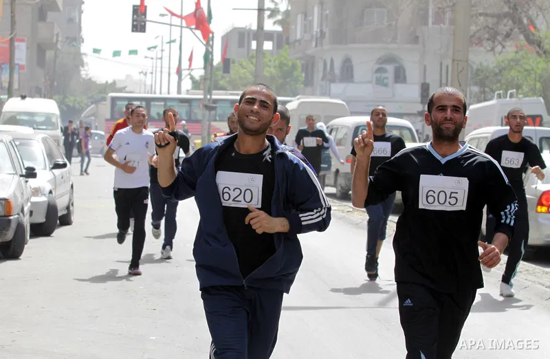 Palestinian youth take part in the symbolic marathon of Jerusalem titled "Freedom for Prisoners" in Gaza City on March 14, 2013 in response to the Jerusalem Marathon which was attended by 20000 racers from 52 countries i...