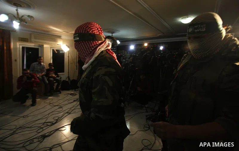 Abu Obeida, Ezzedine al-Qassam Brigades spokesman the military wing of Hamas movement, speaks during a press conference in Gaza city on March 14, 2013. al-Qassam Brigades announced that it would sue the Egyptian newspape...