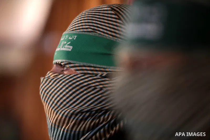 Members of Ezzedine al-Qassam Brigades, the military wing of Hamas movement, attend a press conference in Gaza city on March 14, 2013. al-Qassam Brigades announced that it would sue the Egyptian newspaper al-Ahram after...