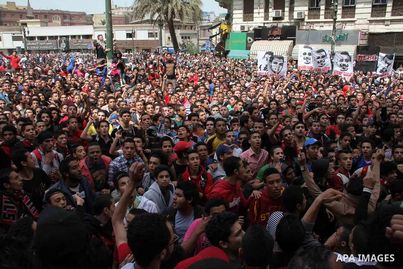 Supporters of Egypt's Al-Ahly football club protest outside the High Court in Cairo on March 16, 2013, demanding the release of fellow members of their Ultras hardcore fan group. The Ultras have long had strained relatio...