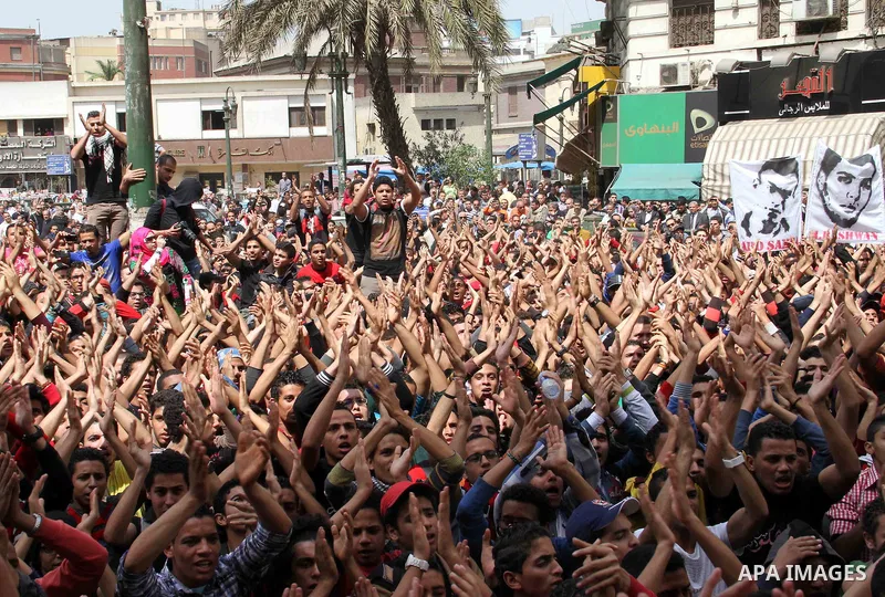 Supporters of Egypt's Al-Ahly football club protest outside the High Court in Cairo on March 16, 2013, demanding the release of fellow members of their Ultras hardcore fan group. The Ultras have long had strained relatio...