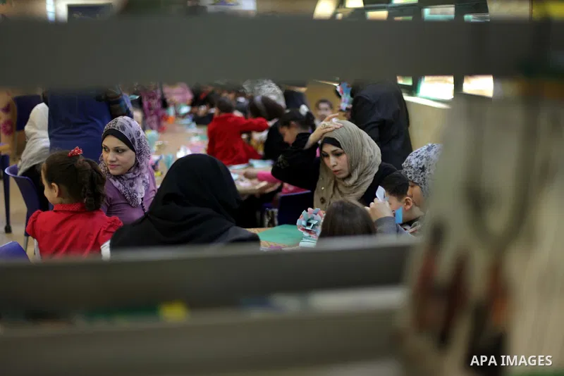 Palestinian women play with their children at a children's cultural center during ''Mother's Day'' in Gaza city, March. 21, 2013. Photo by Ashraf Amra