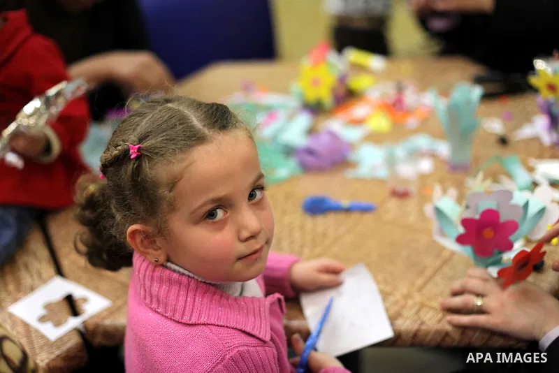 Palestinian women play with their children at a children's cultural center during ''Mother's Day'' in Gaza city, March. 21, 2013. Photo by Ashraf Amra