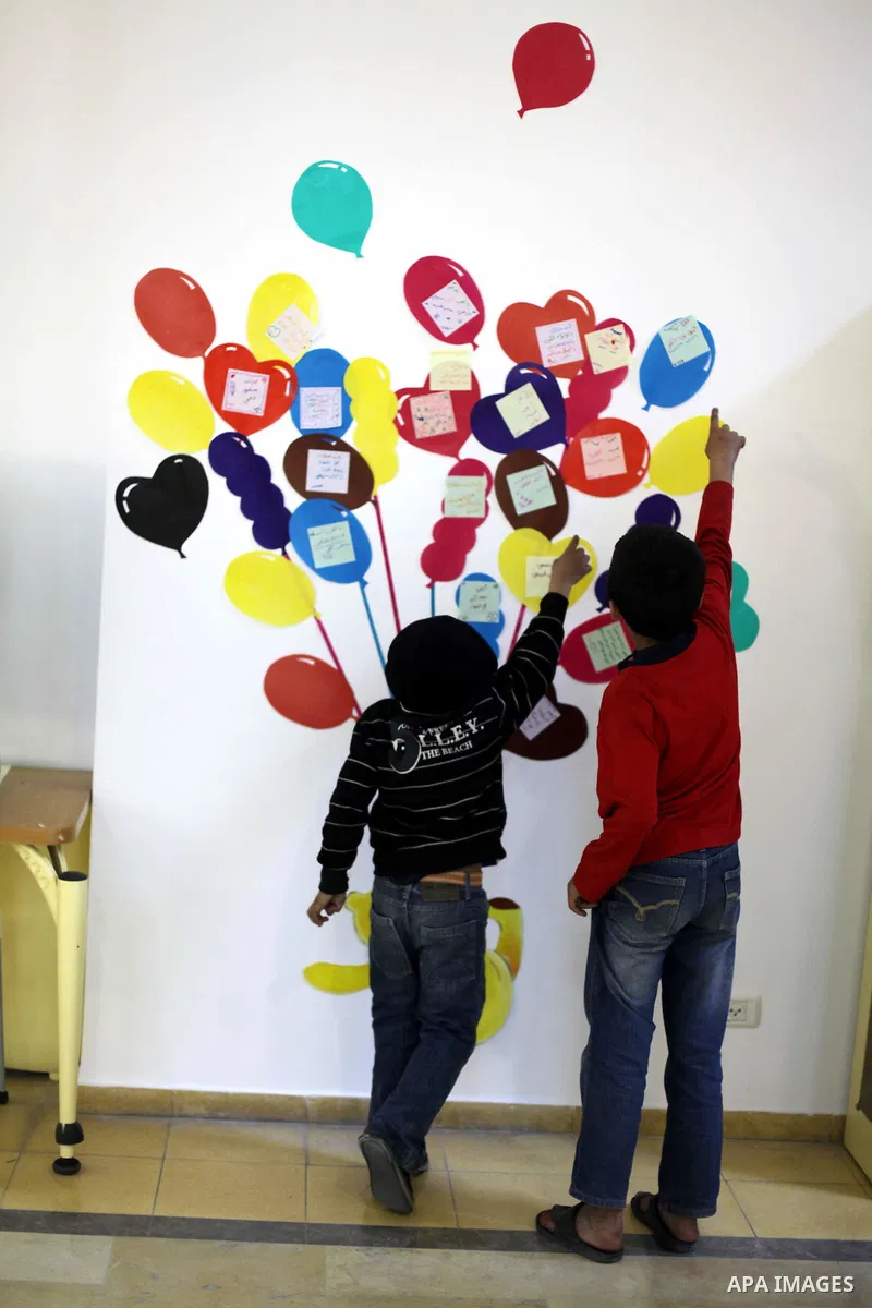 Palestinian children play at a children's cultural center during ''Mother's Day'' in Gaza city, March. 21, 2013. Photo by Ashraf Amra