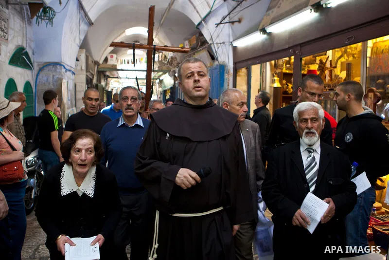 Christian worshipers pray at the Church of the Holy Sepulchre during the Good Friday on March 29, 2013 in Jerusalem's Old City. Good Friday is celebrated by Christians throughout the world as the day Christ was crucified...