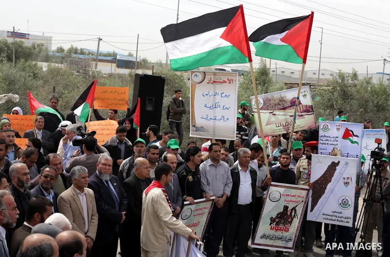 Palestinians take part in a rally marking Land Day in Beit Hanun in the northern Gaza Strip on March 30, 2013. Land Day commemorates the death of six Arab Israeli protesters at the hands of Israeli troops during mass pro...