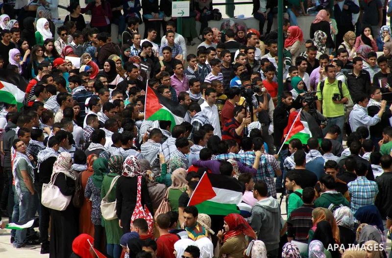 Palestinian youths gather at al-Najah University during a rally marking Land Day in in the West Bank city of Nablus on March 31, 2013. The annual demonstrations mark the deaths of six Arab Israeli protesters at the hands...