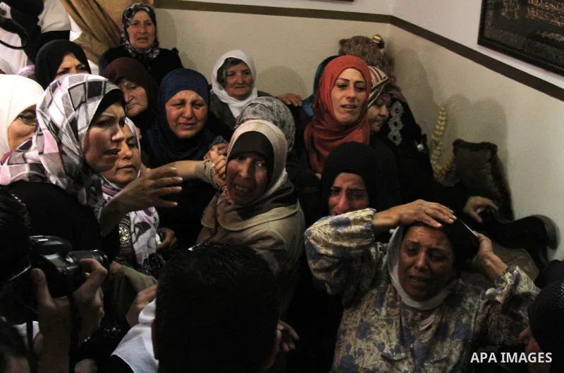 Palestinian relatives of the bodies of Amer Nassar and Naji Balbisi during their funeral in Anabta village near the West Bank city of Tulkarem, 04 April 2013. Israeli soldiers shot dead two Palestinian protesters in the...