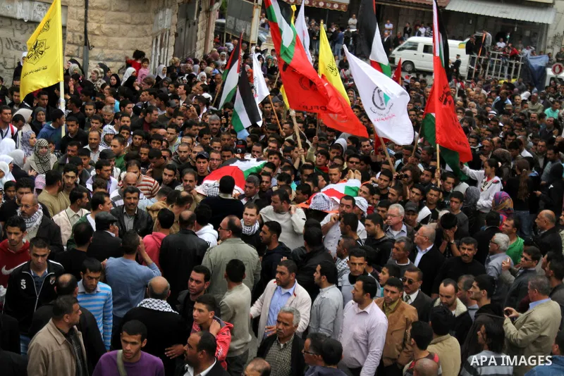 Palestinian mourners carry the bodies of Amer Nassar and Naji Balbisi during their funeral in Anabta village near the West Bank city of Tulkarem, 04 April 2013. Israeli soldiers shot dead two Palestinian protesters in th...