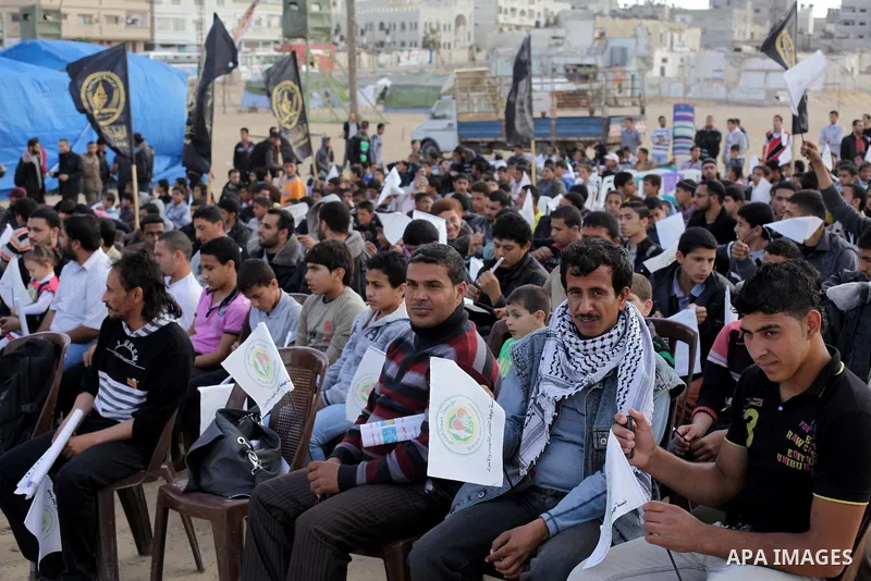 Palestinians sit in the mourning tent of Palestinian prisoner Maisara Abu Hamdiyeh, in Gaza city on April 4, 2013, who was suffering from throat cancer and died at Soroka hospital in the southern Israeli city of Beershev...