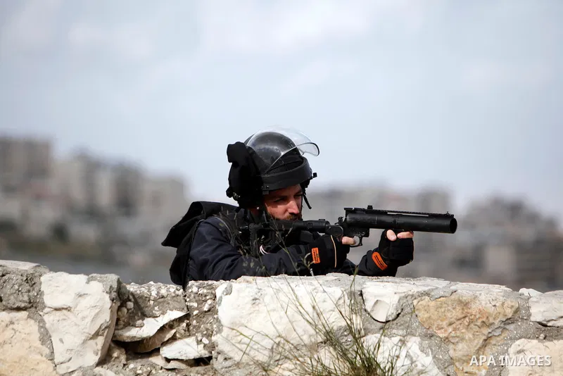 israeli soldiers and border guards during clashes with Palestinian protesters in the Issawiya district of Arab east Jerusalem on April 5, 2013. Israeli police dispersed Palestinian demonstrators after Muslim prayers in J...