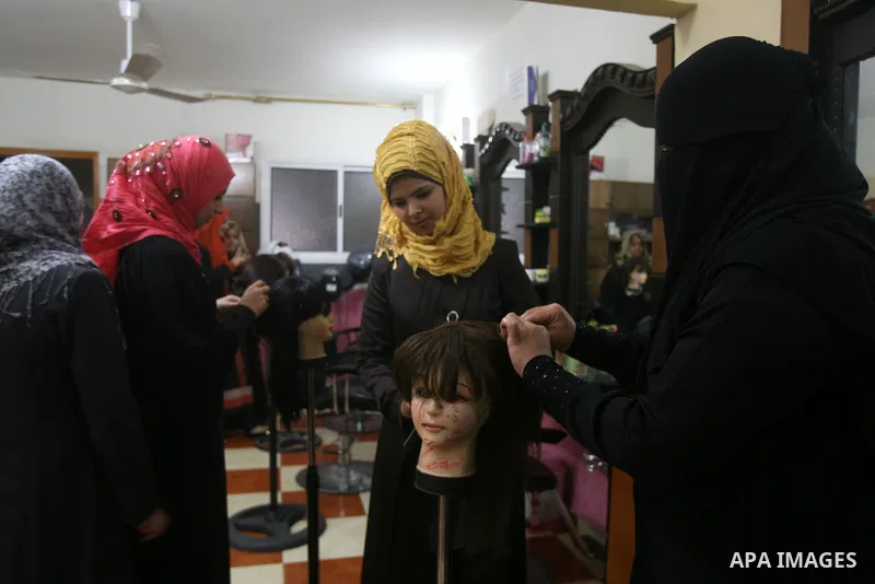 Palestinian girls attend lesson of the hairdressing beauty at The Adam Training Academy, in Rafah town in the southern Gaza Strip on Apr. 06, 2013. Photo by Eyad Al Baba