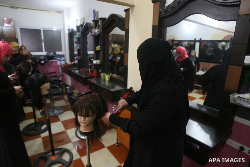 Palestinian girls attend lesson of the hairdressing beauty at The Adam Training Academy, in Rafah town in the southern Gaza Strip on Apr. 06, 2013. Photo by Eyad Al Baba