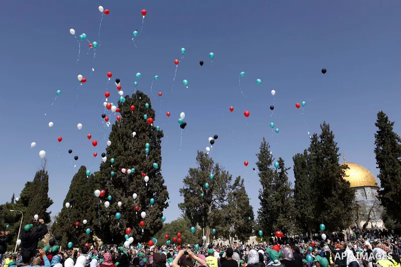 Palestinian children take part in a festival entitled "Aqsa Child festival ", inside the Aqsa Mosque Yard in Jerusalem city, on Apr. 06, 2013. Photo by Sliman Khader