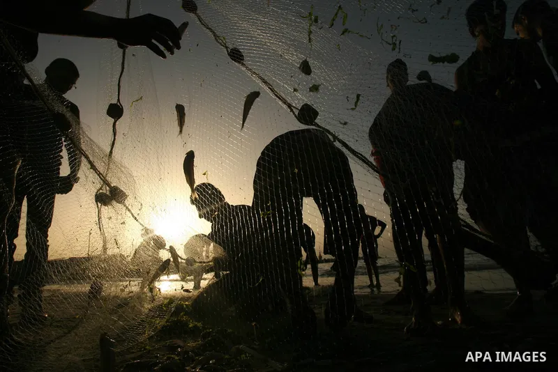 Palestinian men fishing on the beach of Gaza city on Apr. 07, 2013. An Israeli military spokesman announced on March 21, that the Israeli military will again reduce the permitted fishing range in the Gaza Strip from six...