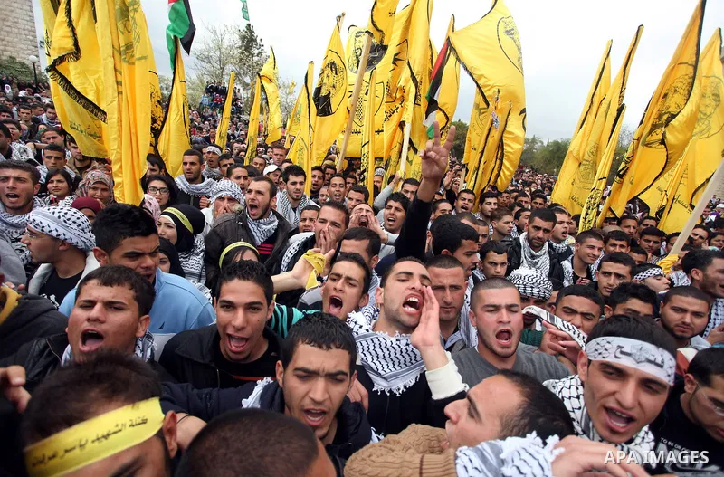 Palestinian students from Birzeit University attend the election debate between students blocs competing in the University student council elections, in the West Bank city of Ramallah on April 09, 2013. Photo by Issam Ri...