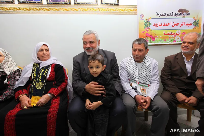 Palestinian Prime Minister in Gaza strip, Ismail Haniyeh, visits home former Ebrahim Baroud following his release from an Israeli jail after being detained for 27 years, at the Jabalyia refugee camp, in the northern Gaza...