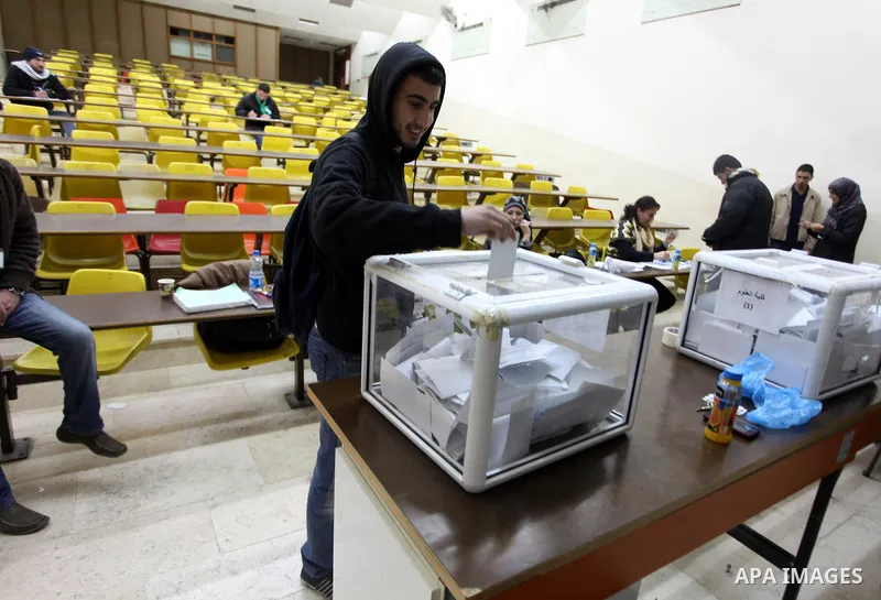 A Palestinian student casts his ballot during the election for the student council at Birzeit University, on the outskirts of the West Bank city of Ramallah on April 10, 2013. The main competitors in the student election...