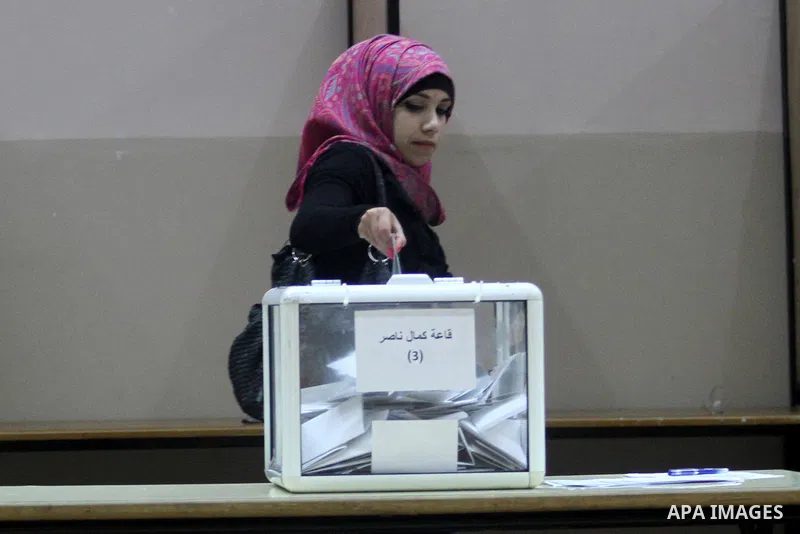 A Palestinian student casts her ballot during the election for the student council at Birzeit University, on the outskirts of the West Bank city of Ramallah on April 10, 2013. The main competitors in the student election...