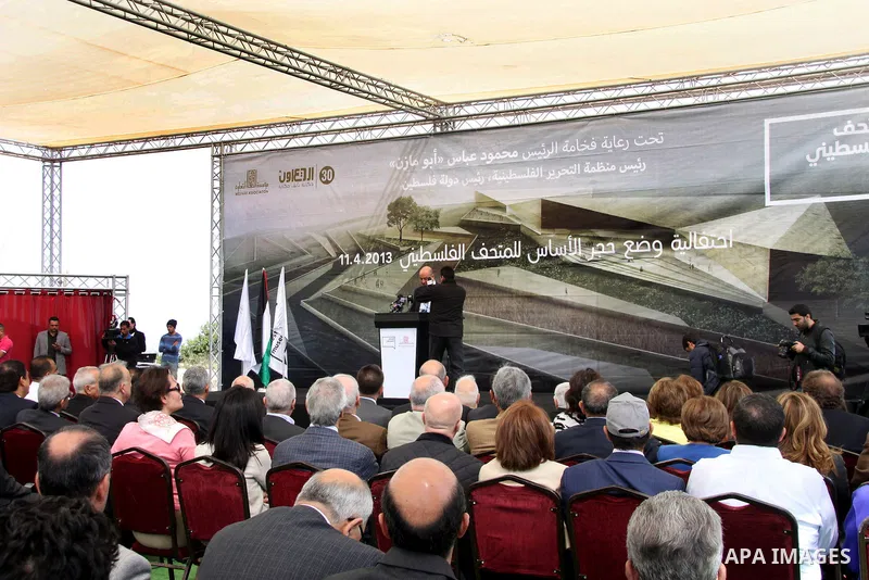 Palestinians attend the ceremony of the unveiling of the foundation stone of the new Palestinian Museum in the Bir Zeit district of the West Bank city of Ramallah on April 11, 2013. Palestinians have started the first ph...