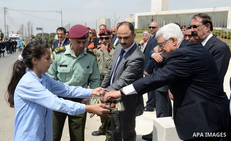 Palestinian President Mahmoud Abbas (Abu Mazen) participate in a Carnival children of the State of Palestine, in front of the grave of the late Palestinian leader Yasser Arafat in the West Bank city of Ramallah, on Apr....