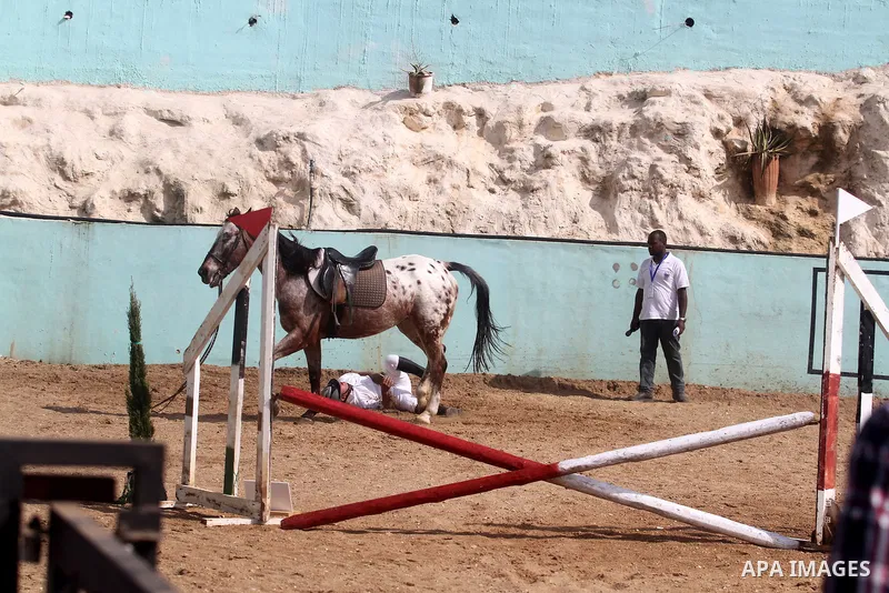 Palestinian jockeys demonstrate their skills as they ride their horses during a participate in the first Spring Festival at Turmus'ayya village near in the West Bank city of Ramallah, on Apr. 13, 2013. Photo by Issam Rim...