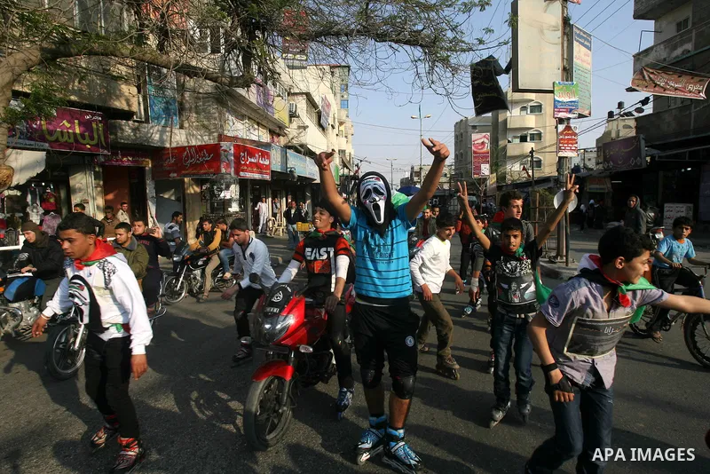Members of Palestinian youth skate team wear ghost face's masks as they take part in a rally to show solidarity with Palestinian prisoners inside Israeli jails, ahead of Palestinian prisoner's day in south of Gaza strip...